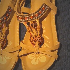 Cute flat sandals for women in grays and browns.